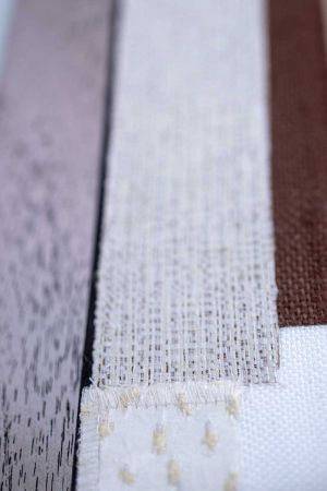 Bonded textile strips on textile wall objects