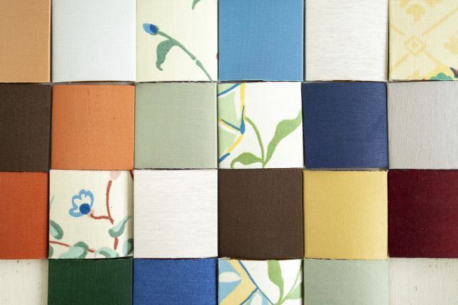 Sustainable interior wall design using reclaimed fabrics