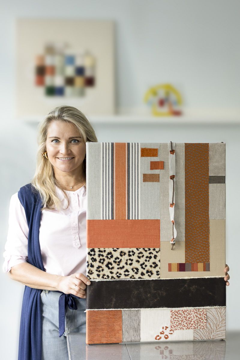 Elena Kamphuis with upcycled wall art, circular storytelling design